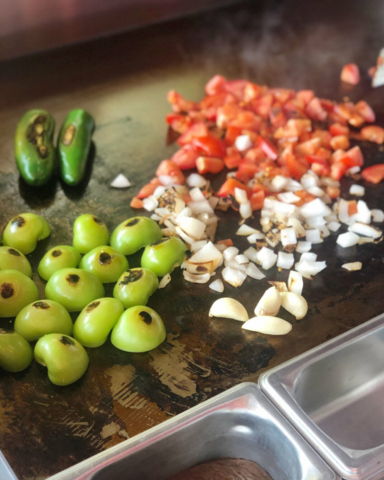 Vegetables roasting on a stove to get a roasted flavor