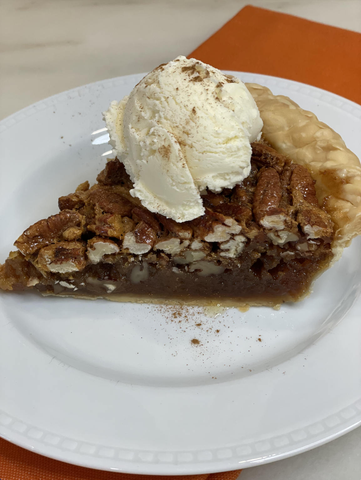 Bourbon pecan pie with ice cream